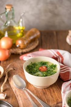 Caldo verde popular soup in Portuguese cuisine. traditional ingredients for caldo verde are potatoes, collard greens , olive oil and salt. Additionally garlic or onion may be added.