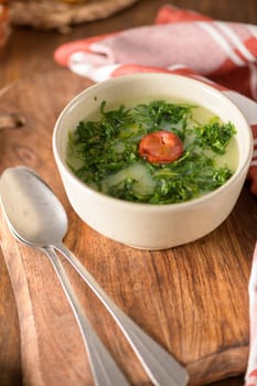 Caldo verde popular soup in Portuguese cuisine. traditional ingredients for caldo verde are potatoes, collard greens , olive oil and salt. Additionally garlic or onion may be added.