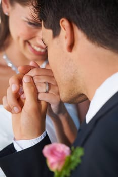 Couple, wedding ring and hand in marriage with bride and smile at celebration and trust event. Flower, loyalty and care with romance and holding hands with love and commitment with woman and man.