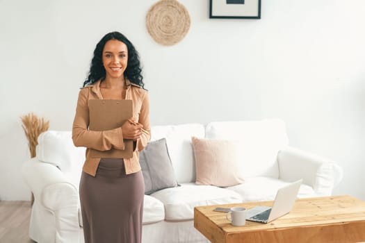 Psychologist woman in clinic office professional portrait with friendly smile feeling inviting for patient to visit the psychologist. The experienced and confident psychologist is crucial specialist