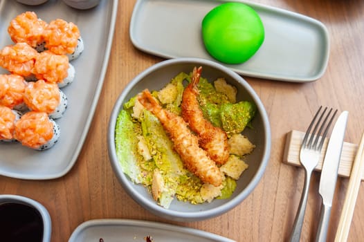 Asian salad with tempura shrimp and pistachios. High quality photo