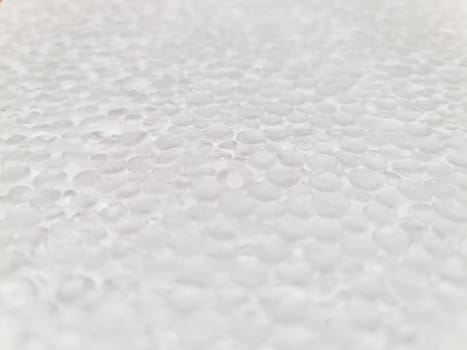 Sliced polystyrene foam white texture, shallow depth of field.
