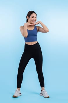 Full body asian woman in sportswear portrait, smiling and posing cheerful gesture. Workout training with attractive girl engage in her pursuit of healthy lifestyle. Isolated background Vigorous