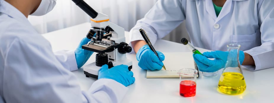 Laboratory researcher team advance healthcare with scientific expertise and laboratory equipment, researching new medicines and developing cure in the lab. Panorama Rigid