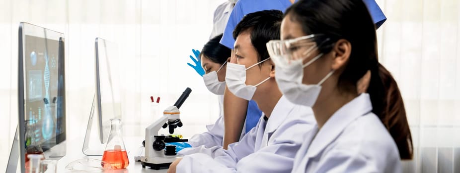 Laboratory researcher team advance healthcare with scientific expertise and laboratory equipment, researching new medicines and developing cure in the lab. Panorama Rigid