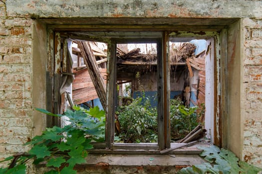 old wooden window frame in abandoned house, closeup