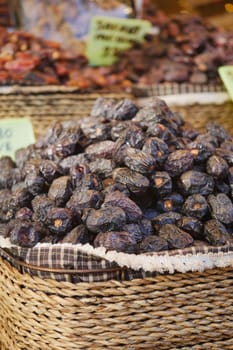 many date fruits display for sale at local market .