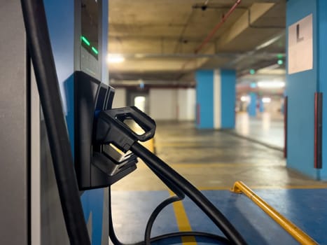 DC charging station to charge electric vehicles in the parking garage of the shopping mall