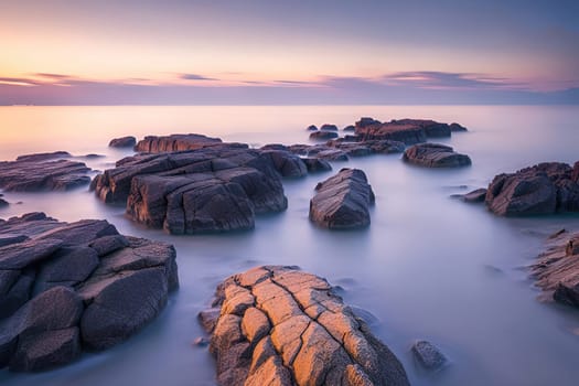 Beautiful seascape with long exposure of rocks and sea at sunset.Beautiful seascape. Dramatic sunset over the sea.