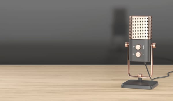 Modern studio microphone on wooden desk