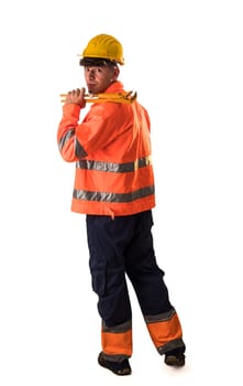 A man in an orange safety jacket holding a wrench