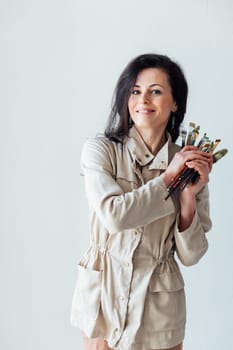 a woman with brushes for drawing artist