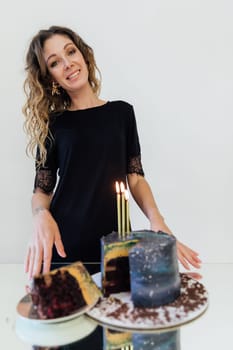 a beautiful woman piece of cake with candles for holiday