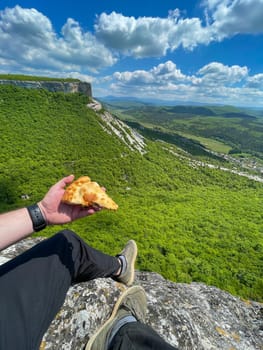 food on a hike man with bread sitting on a mountain journey