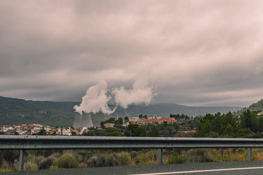 The spanish typical village of Cofrentes, with its castle in the foreground and its nuclear plant in the background. High quality photo