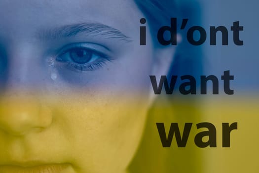 ukrainian baby girl cryingn on the right is the inscription I don't want war in black letters.Ukraine flag background blue and yellow color background.Stop the war in ukraine. High quality photo