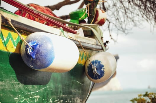 colorful tropical boat on the seashore in the sand side view. High quality photo