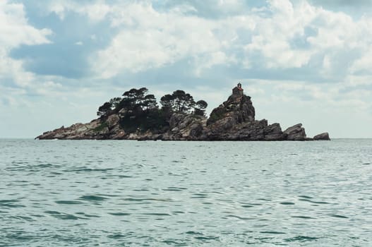 landscape photo of the sea and the island, close-up. The landscape is beautiful, the background for the screen saver. High quality photo