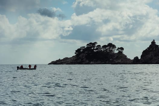 landscape photography of the sea, a beautiful landscape, there is a place for an inscription. In the sea, an island in the distance and a boat on the water nearby. High quality photo