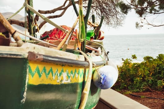 colorful tropical boat on the seashore in the sand side view. High quality photo