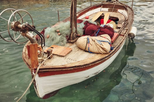 a boat stands on the water with accessories for catching fish. Boat close-up. High quality photo