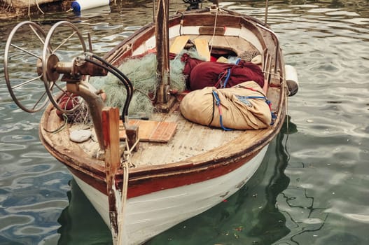 a boat stands on the water with accessories for catching fish. Boat close-up. High quality photo