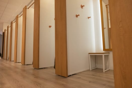 empty fitting rooms in brown and white in a store of things. there is a place for an inscription. High quality photo