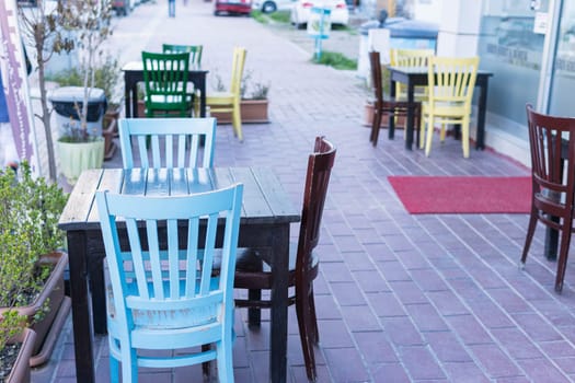 Empty tables in a cafe on the street during lunch break. High quality photo