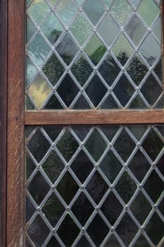 vintage window with mesh inside glass window.Antique, window close up. High quality photo