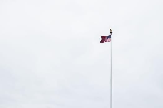 USA flag against the sky isolated, there is a place for an inscription. High quality photo