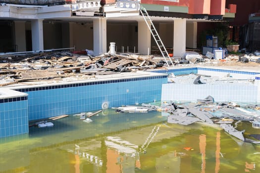 Pool damage, pool repair, ugly pool, dirty backyard pool. High quality photo