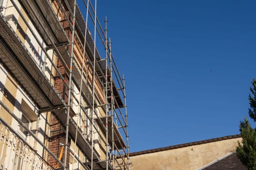 photo of a building that is being built in the city. Photo from bottom to top. High quality photo