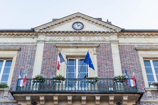 The flag of the European Union and the flag of France flutters in the wind close-up. High quality photo