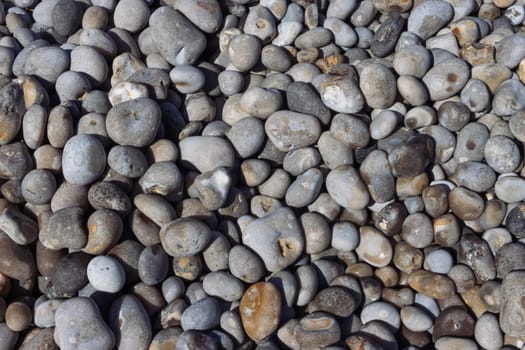 Pebble stone or river stone background with a place for an inscription.beach on the sea close-up. High quality photo