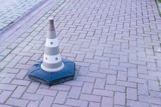 Background with traffic plastic cone on road track. High quality photo