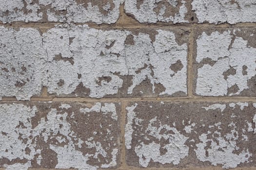 gray empty texture for an inscription. the wall is old with plaster in the form of bricks. High quality photo