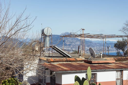 roof of the building with water heating system for the shower. High quality photo