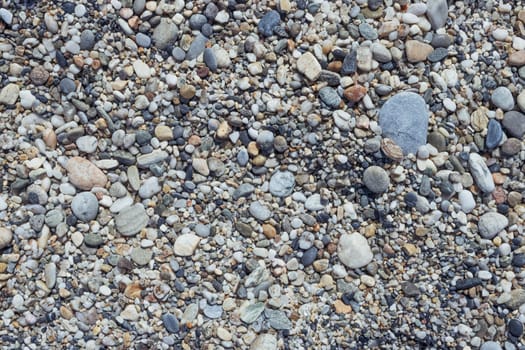 Pebble stone or river stone background with a place for an inscription.beach on the sea close-up. High quality photo