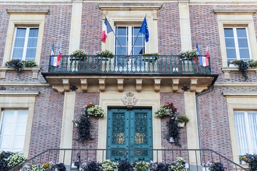 The flag of the European Union and the flag of France flutters in the wind close-up. High quality photo