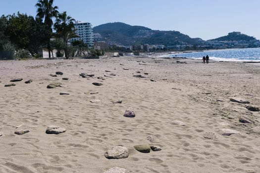 Beautiful view of the seashore, sandy beach, sea, mountain view. The background is beautiful, a place for an inscription. High quality photo