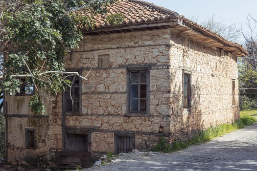 old brick house on the road to the park in the village. High quality photo