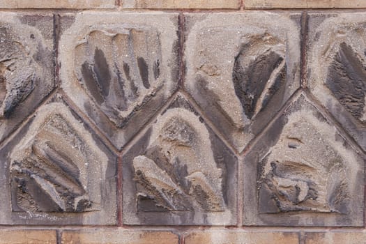 the texture of the old tiles on the wall of the building close-up. High quality photo