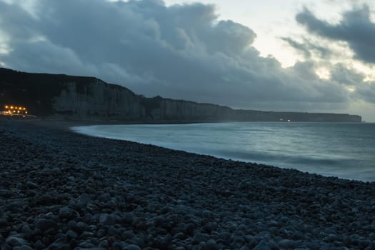 evening seascape, around the mountains and the sea and the beach with pebbles there is a place for an inscription. High quality photo