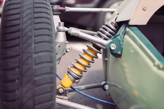 shock absorber and spring closeup on racing car isolated. High quality photo