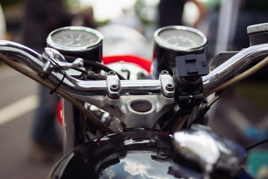 close-up of a speedometer on a motorcycle and steering wheel isolated. High quality photo