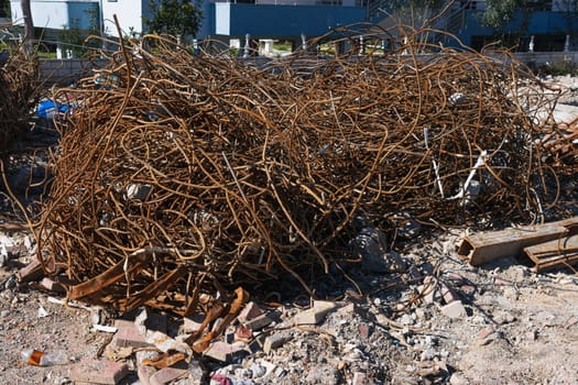 A fragment of old copper wire and sheet from a recycling company lies on the ground for wallpaper and background. High quality photo