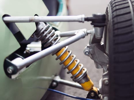 shock absorber and spring closeup on racing car isolated. High quality photo