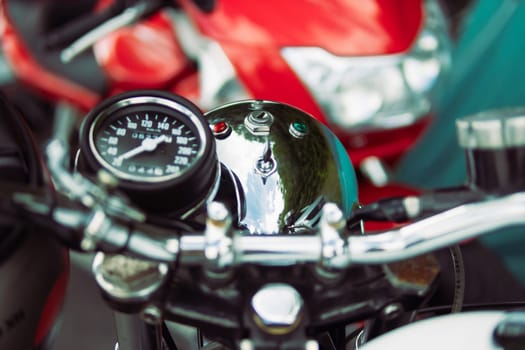 close-up of a speedometer on a motorcycle and steering wheel isolated. High quality photo