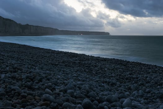 evening seascape, around the mountains and the sea and the beach with pebbles there is a place for an inscription. High quality photo