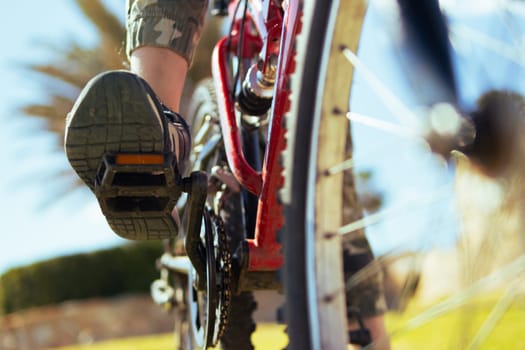 close-up on the child's foot on the pedal, there is a place for the inscription. High quality photo